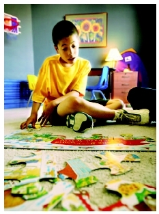 Therapy for autistic children may include working on jigsaw puzzles. ( Michael Macor/San Francisco Chronicle/Corbis.)