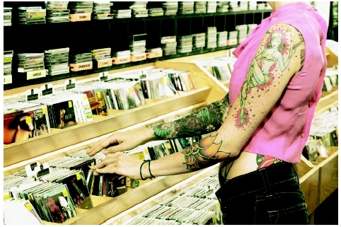 Teenage girl with tattoos. ( PictureNet/Corbis.)