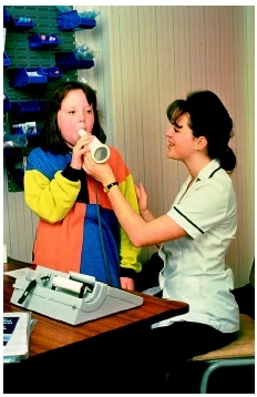 A cystic fibrosis patient receives a pulmonary function test. (Custom Medical Stock Photo Inc.)